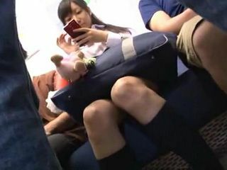 Jailbait schoolgirl gets her wet nippons poked in public during Tokyo train debauchery